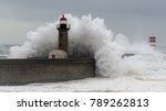 Waves Crashing Over A Lighthouse