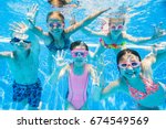Little kids swimming  in pool ...