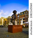 Small photo of AMSTERDAM, NETHERLANDS, APRIL, 23 2018: Statue of Dutch writer Eduard Douwes Dekker 1820-1887 known as Multatuli, famous for novel, Max Havelaar 1860 , which denounced abuses of colonialism