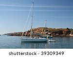 Small photo of Yacht under bare poles by the rocky atlantic shore
