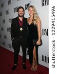 Small photo of NASHVILLE, TN - NOV 13: Thomas Rhett (L) and wife Lauren Akins attends the BMI Country Awards 2018 at BMI Nashville on November 13, 2018 in Nashville, Tennessee.