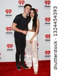 Small photo of LAS VEGAS-SEP 19: Shawn Mendes (L) and Camila Cabello of Fifth Hamony attend the 2015 iHeartRadio Music Festival at MGM Grand Garden Arena Night 2 on September 19, 2015 in Las Vegas, Nevada.