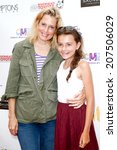 Small photo of BRIDGEHAMPTON, NY-JUL 19: Ali Wentworth (L) and daughter Elliott Stephanopoulos attend the Annual Family Fair at Children's Museum of the East End (CMEE) on July 19, 2014 in Bridgehampton, New York.