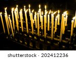 church candle in a row. ... | Shutterstock . vector #202412236
