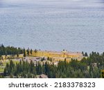Sunny beautiful high angle view of the Yellowstone Lake landscape and Lake Yellowstone Hotel in Yellowstone National Park at Wyoming