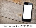 Smart phone on wooden table background with copy space