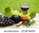 Red Wine Glass And Bottle With...