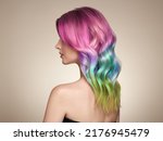 Small photo of Beauty Fashion Model Girl with Colorful Dyed Hair. Girl with perfect Makeup and Hairstyle. Model with perfect Healthy Dyed Hair. Rainbow Hairstyles