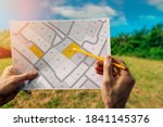 sale of building plot of land for house construction. cadastral map on field background