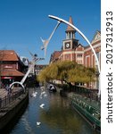 Small photo of LINCOLN, UK - APRIL 20, 2013: View along the River Witham and the empowerment Sculpture by Richard Broadbent