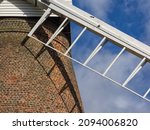 Small photo of RAYLEIGH, ESSEX, UK - OCTOBER 27, 2017: Detail view of vanes and brickwork of Rayleigh Windmill - a Grade 2 Listed building