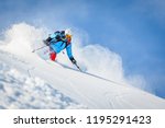 Male freeride skier in the mountains