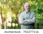 Elderly Man Smiling Outdoors In ...