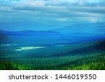 Scandinavian panorama. Northern Scandinavian swamps and boreal coniferous forest on plateaus (fjel). Characteristic glacial kettle basin with river and lakes. Glaciated landscape