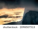 Small photo of Moire Sea. Tones and colors of the sunset sea, black steep cliffs and shadow clouds. Sea view from above, moire effect