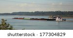 Tug Boat And Barges Of...