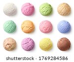Set of ice cream scoops of different colors and flavours isolated on white background, top view