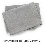 Folded grey cotton napkin isolated on white background top view