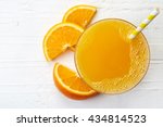 Glass of fresh orange juice from top view
