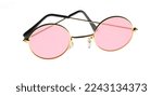 Small photo of Rose tinted glasses, spectacles, specs isolated on white background. Misplaced optimism, optimist concept.
