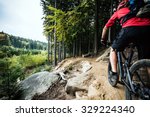 Mountain biker riding on bike in autumn inspirational mountains landscape. Man cycling MTB on enduro trail track. Sport fitness motivation and inspiration.