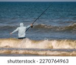 A Lone Coastal Fisherman With A ...