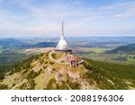 Aerial view of Jested tower with cable car on the top of Jested mountain 1 012 m (3,320 ft). Famous tourist attraction near Liberec in Czech republic, Europe. 