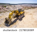 Small photo of KAZNEJOV, CZECH REPUBLIC - JULY 3, 2022: Aerial view of excavator Komatsu PC800LC-8 with hightech working system TriPower from Echle Hartstahl. Kaolin open pit mine for ceramic tiles production.
