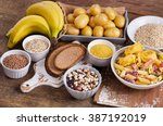 Foods high in carbohydrate on wooden table. Top view