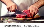 Man Cutting Beef Meat.
