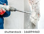 Man Using A Jackhammer To Drill ...