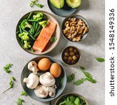 stock-photo-ketogenic-diet-ingredients-for-cooking-dinner-raw-salmon-avocado-broccoli-bean-olives-nuts-1548149336.jpg