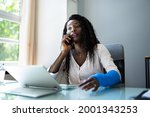 Small photo of Broken Arm Injured Worker Compensation Coverage. Using Office Laptop