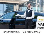 Small photo of Valet Parking Hotel Service. Man Driver Standing