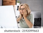 Small photo of Frustrated Businesswoman Looking At Her Computer Screen In Dismay