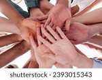 Small photo of Building Cohesion: People Join Hands in Team Spirit for Community Circle