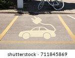 High angle view of electric car sign in parking area