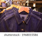 jeans jacket.with blue jeans on the hanger . for sale in the shop

