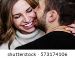 Young couple in love hug each other on the black background 