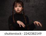 A girl with braids in a gothic...