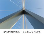 bridge tower with stay cables against a blue sky, abstract structure background