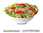 Small photo of Fresh green leafy salad with tuna avocado and tomato isolated on white background. Concept for a tasty and healthy meal