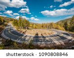 Highway with hairpin turn (switchback) at autumn sunny day in Rocky Mountain National Park. Colorado, USA. 