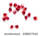 Pomegranate Seeds On A White...