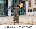 Small photo of Manchester, UK - October 10, 2021: The statue of Emmeline Pankhurst is decorated by Amnesty International representatives to mark the STOP THE RIGHTS RAID Week of Action 10-17 October 2021.