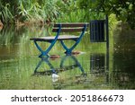 Flooded Park Bench And Trashcan ...