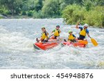 Small photo of Yappy family of four river rafting on the catamaran