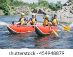 Small photo of Yappy family of four river rafting on the catamaran