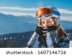 Skier girl on the background of high mountain Carpathians in Ukraine. Winter sport.