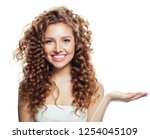 Cheerful woman showing open hand with empty copy space isolated on white. Expressive facial expressions. 